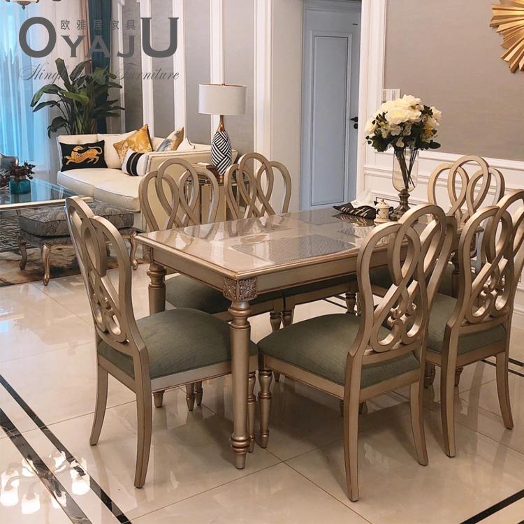 Italian light luxury champagne gold solid wood carving simple dining table dining chair combination rectangular home dining table furniture customization
