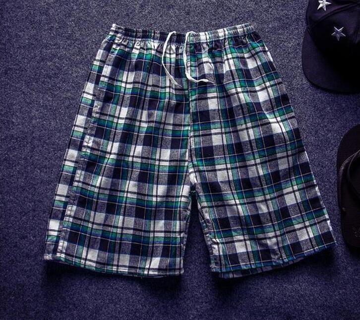 Đàn ông trung niên quần năm điểm cotton mùa hè quần lỏng mùa hè quần short giản dị mặc quần đi biển quần thun nam