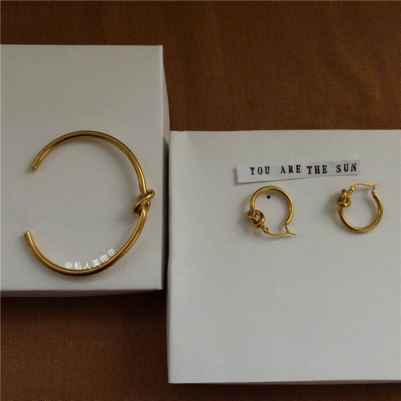 Personality earrings women's trend fashion high-end atmosphere color forest style simple temperament chic knotted circle retro earrings