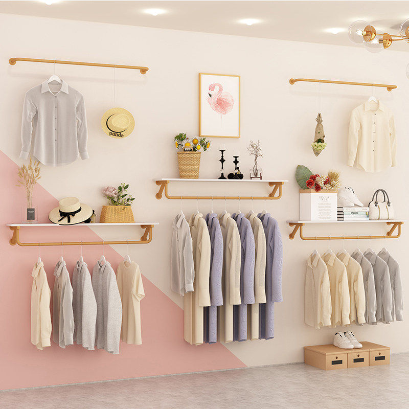 Clothing store special display rack on the wall hanging gold simple boys and girls clothing shop combined display clothes shelf