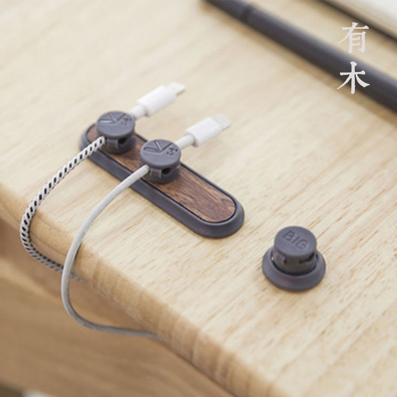 There are wooden TUP 2nd generation magnetic suction line hub bcase wooden data charging line storage desktop car