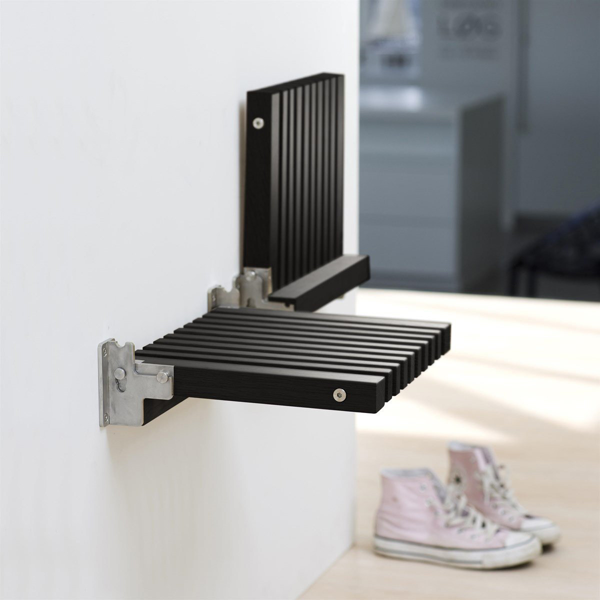 Valley and minimalist living room entrance door log folding and changing shoes stool concealed on the door hanging wall wearing a shoe stool chair