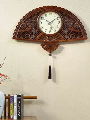 Chinese style clock living room wall clock home fan-shaped solid wood carving clock overlord silent quartz wall clock Chinese style
