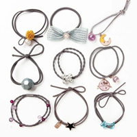 Набор из 9 предметов светло-коричневого цвета, диаметр около 4,5 см.