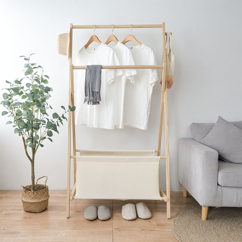 Simple solid wood comes with dirty clothes basket coat rack Nordic famous hotel bedroom living room storage floor clothes rack