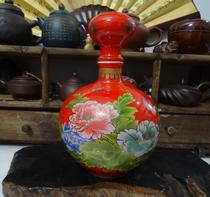 Bottle collection piece of red ceramic depiction of rich peony bottle fine ceramic alcoholic alcohol props in kind photo