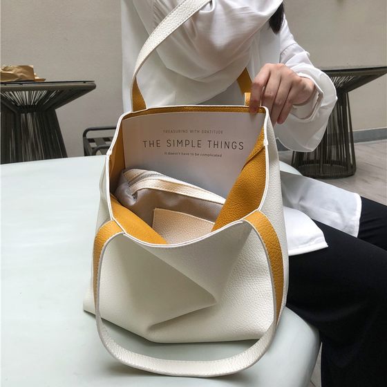 Tot shoulder large bag women's commute large -capacity bucket 2022 new autumn and winter casual niche soft leather high -level sense
