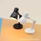 Miniature desk lamp can be used to illuminate the scene props