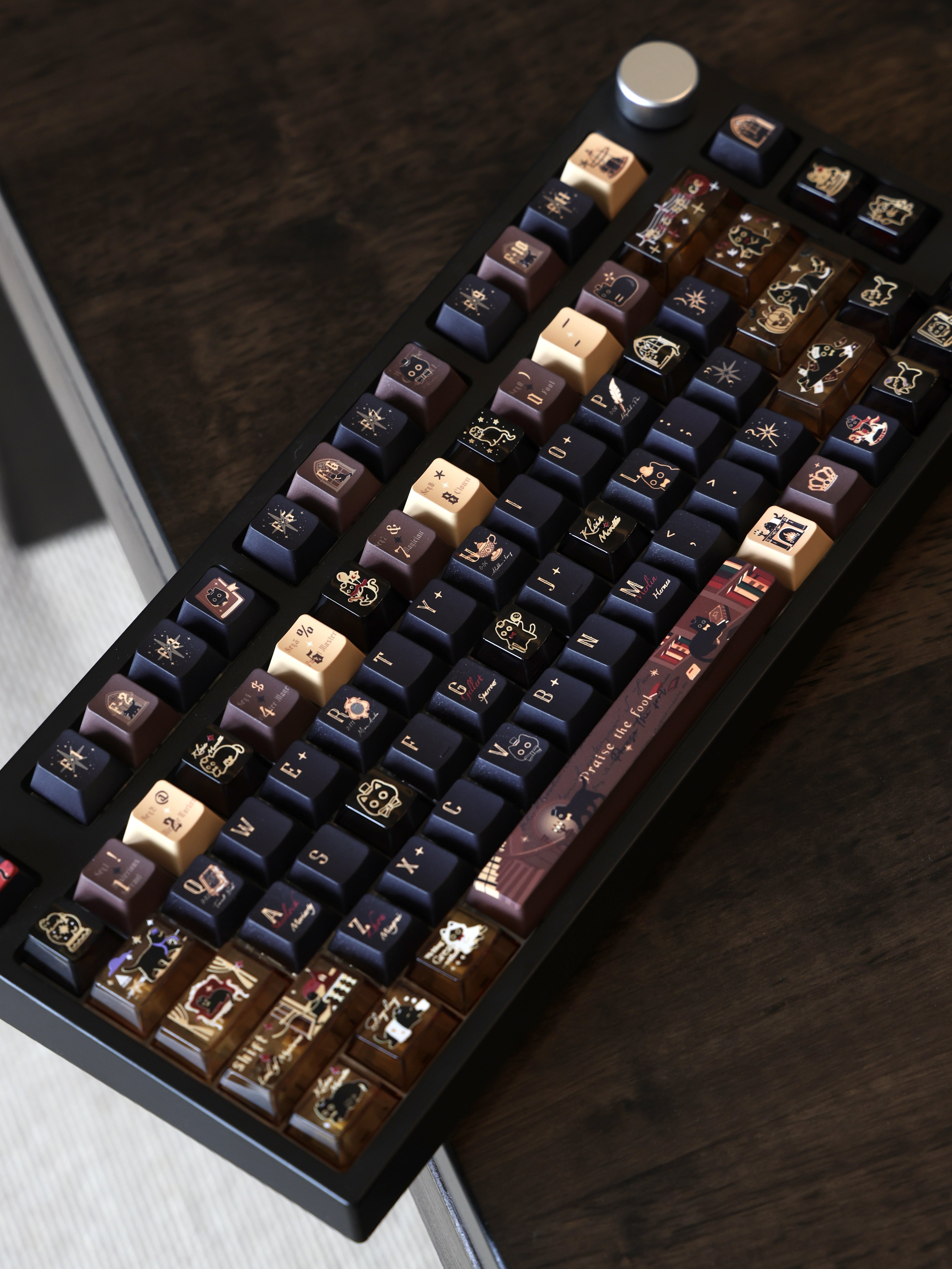 Angled view of cat-themed accent keycaps installed on a keyboard