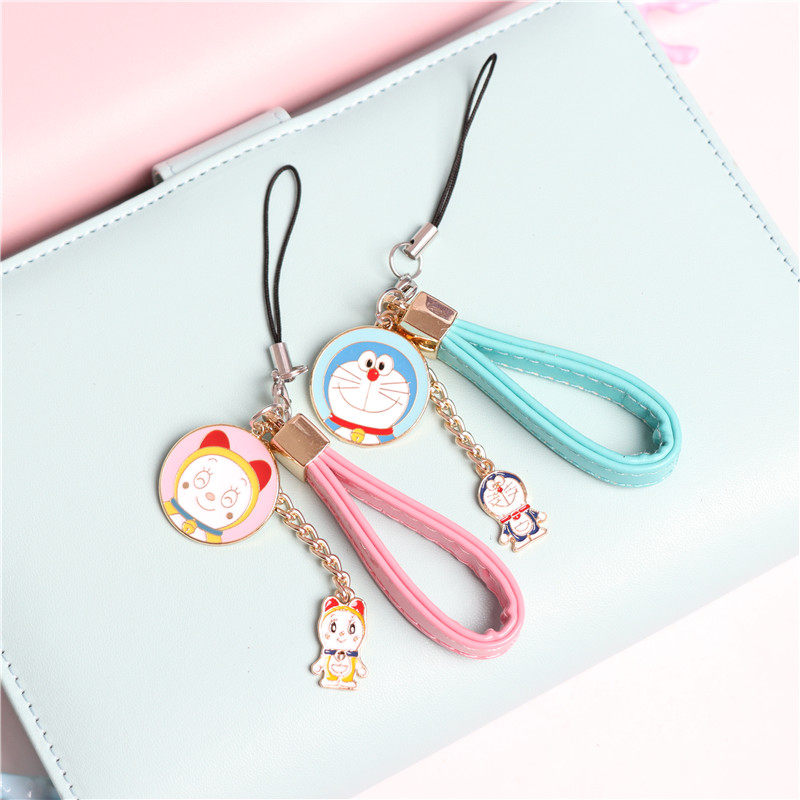 Cartoon machine cat Doraemon A dream biker with a small pu leather rope mobile phone protective shell pendant pendant male and female student couple ornaments