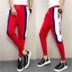 Quần tâm linh nam quần Slim chân chân xã hội quần màu đỏ với đồng phục thể thao quần quần jean nam Quần mỏng