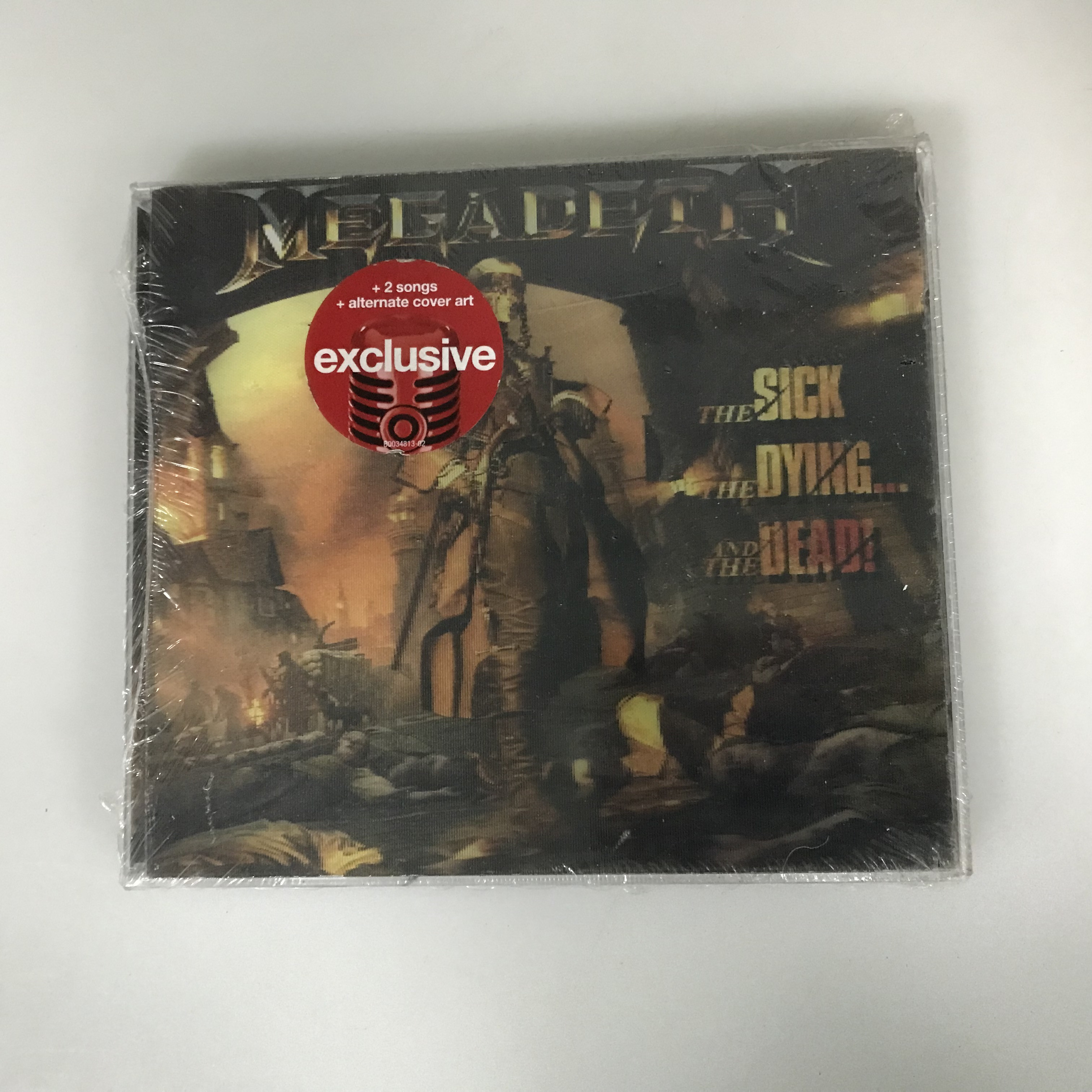 Нераспечатанный диск Megadeth The Sick, The Dying and The Dead, Нижняя бумага порвана. Изображение 1
