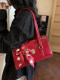 This year's hottest red baguette wedding bag for women 2026 new winter high-end light luxury niche shoulder bag for women