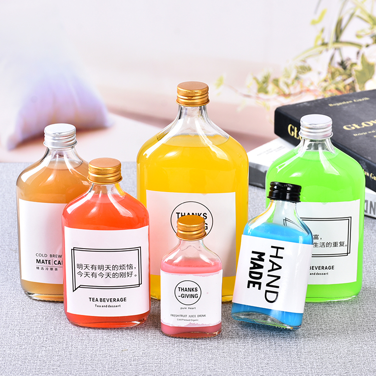 Creative new European-style sealed glass bottle aluminium cover milk tea bottle transparent thickened flat commercial packaging juice bottle