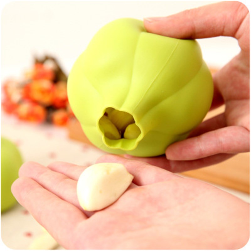 New garlic peeling peeler household manual kitchen tool automatic twisting garlic pressing garlic peeling garlic artifact
