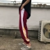Phiên bản Hàn Quốc của mùa xuân mới phong cách Harajuku nam và nữ chân chùm quần harem màu sắc phù hợp với ngọn lửa in quần lỏng lẻo thủy triều quần baggi nữ công sở Quần Harem