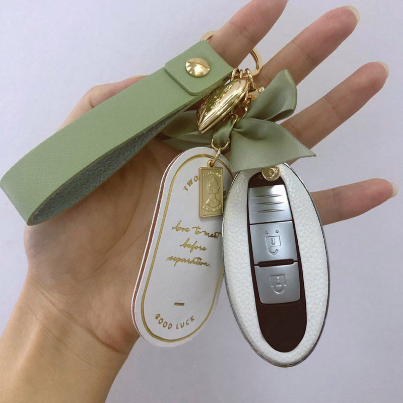 Applicable to Nissan key cover female Dongfeng Sylphy Qijun Tianlai Jinke Qashqai Tiida Nissan Bluebird car buckle