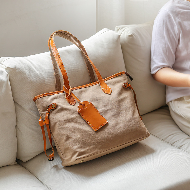 Xiaosheng has Mitote bag women's one-shoulder portable 2021 new all-match canvas with cowhide large-capacity commuter bag