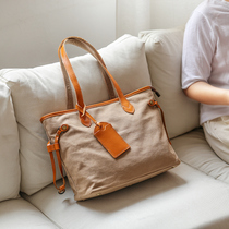 Xiao Sheng has Mitot bag woman with a single shoulder handle 2021 new hundred and canvas with bull skin large capacity commuter package