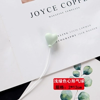 Зеленый воздушный шар в форме сердца