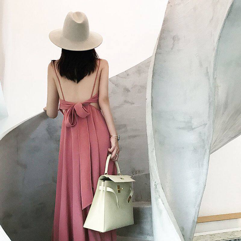 Hainan Sanya beach skirt female summer 2022 new Thailand seaside vacation super fairy backless suspender dress is thin
