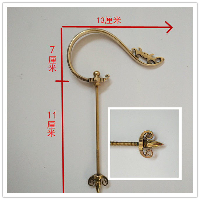 The brow cage is pegged with a scorpion drawn copper hook