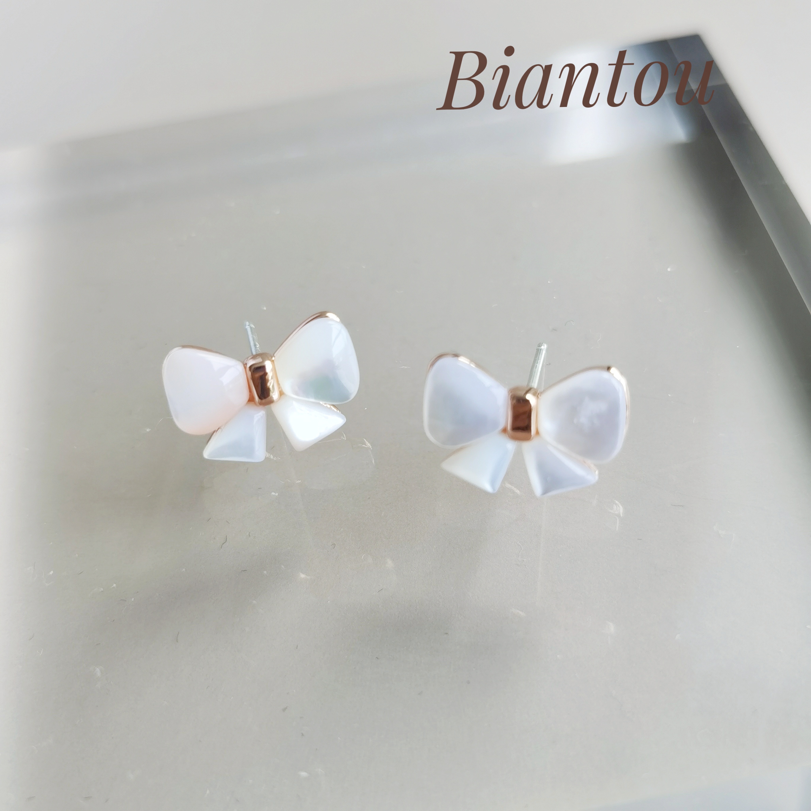 Popcorn New pint girl small fresher ear decorated with white Sichuan fritillary butterfly knot 925 silver needle ear needle delicate and small fashion