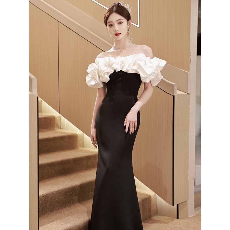 Black elite evening dress, open shoulders, bright catchy style, fitted, 