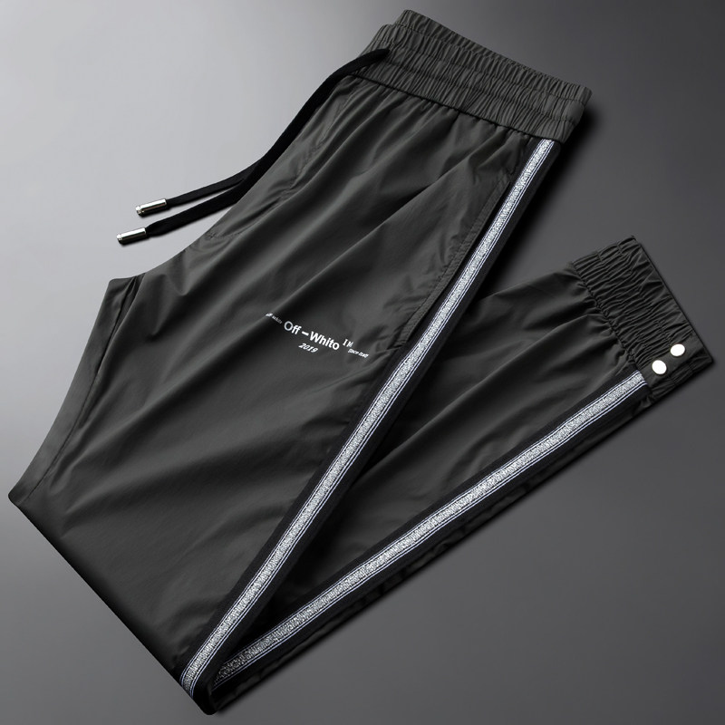 Light luxury trend ice silk casual sports pants men's slim small feet green summer silky nine-point quick-drying pants thin section