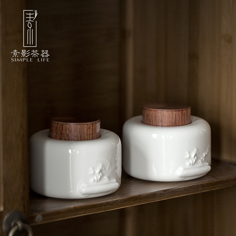 Plain film dehua white porcelain tea pot suet jade porcelain anaglyph ebony cover household ceramic tea storehouse wake tea boxes