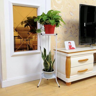 Wrought iron flower shelf in the living room with flower pot storage floor-to-ceiling two-story golden ge in a single bedroom