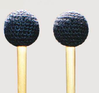 The Orff hit the instrument hammer with a hammer.