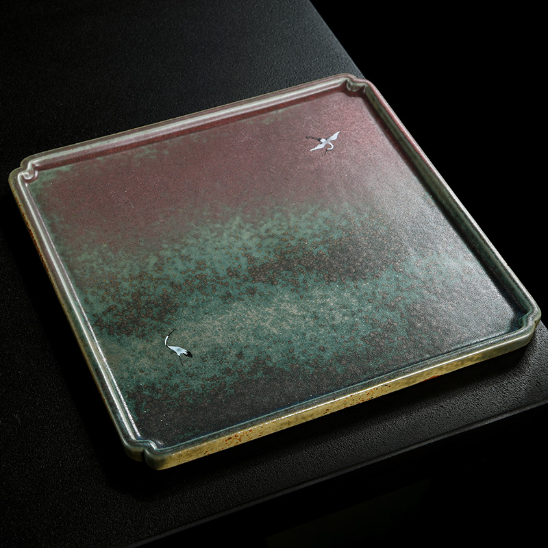 Old ceramic up saucer at the grid plate of Japanese zen tea tray was restoring ancient ways of household dry plate bearing tea pot heart plate