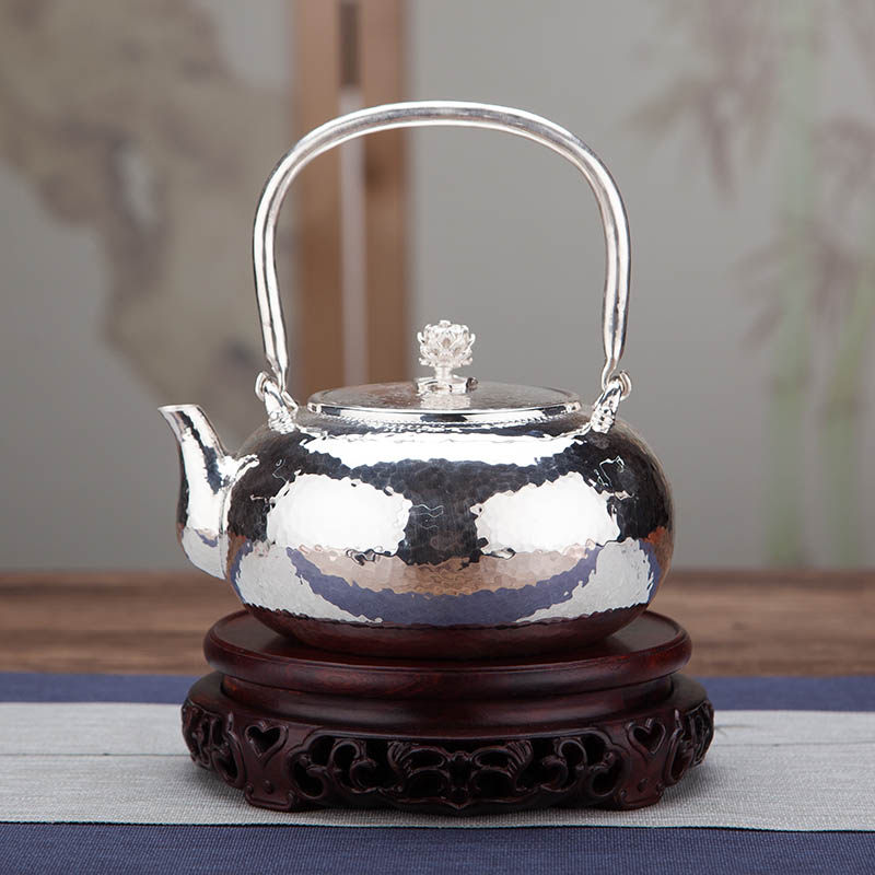 Pure silver 999 silver pot pure handmade one mouth to play silver pot home cooking teapot tea tea maker bright mirror hammer veins