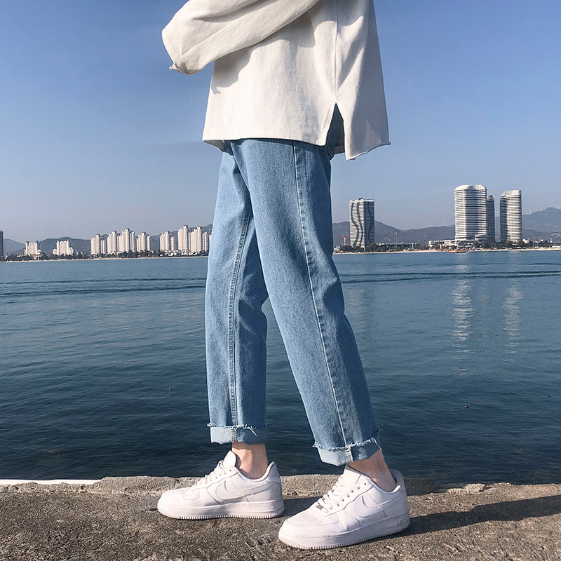 Jeans men's slim straight raw edge pants Korean version trend 2022 spring and summer tide brand ins light blue nine-point pants