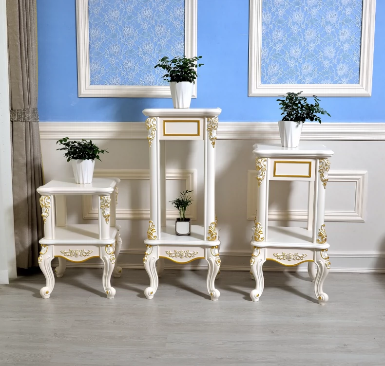 Giá 
            đỡ hoa theo phong cách châu Âu tùy chỉnh giả gỗ nguyên khối phòng khách màu trắng đơn giản hiện đại mục vụ hoa một vài thì là màu xanh lá cây giá đỡ chậu hoa giá đỡ nhiều tầng kệ cây cảnh ban công kệ để chậu hoa ban công