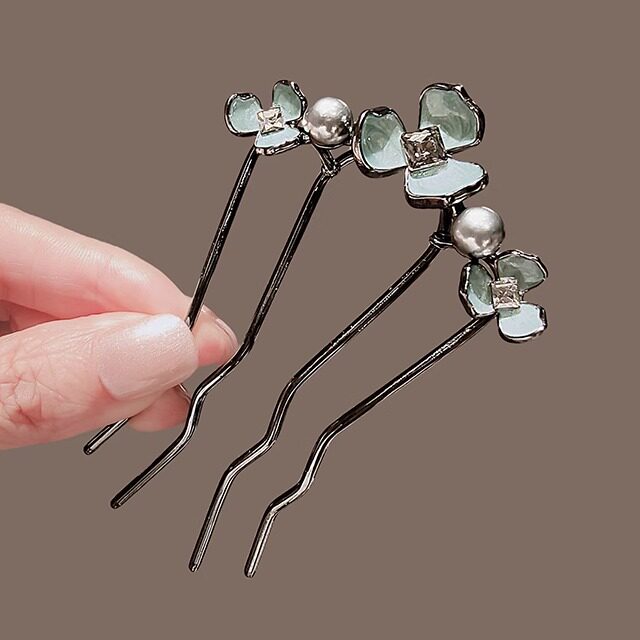 French-style elegant hair comb with flowers, beads, and rhinestones; a hairpin or hair ornament for women's updos.