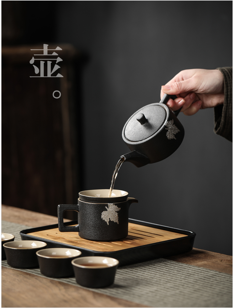 Black pottery travel kung fu tea set to crack a pot of four cups of small portable bag outside Japanese mini household contracted