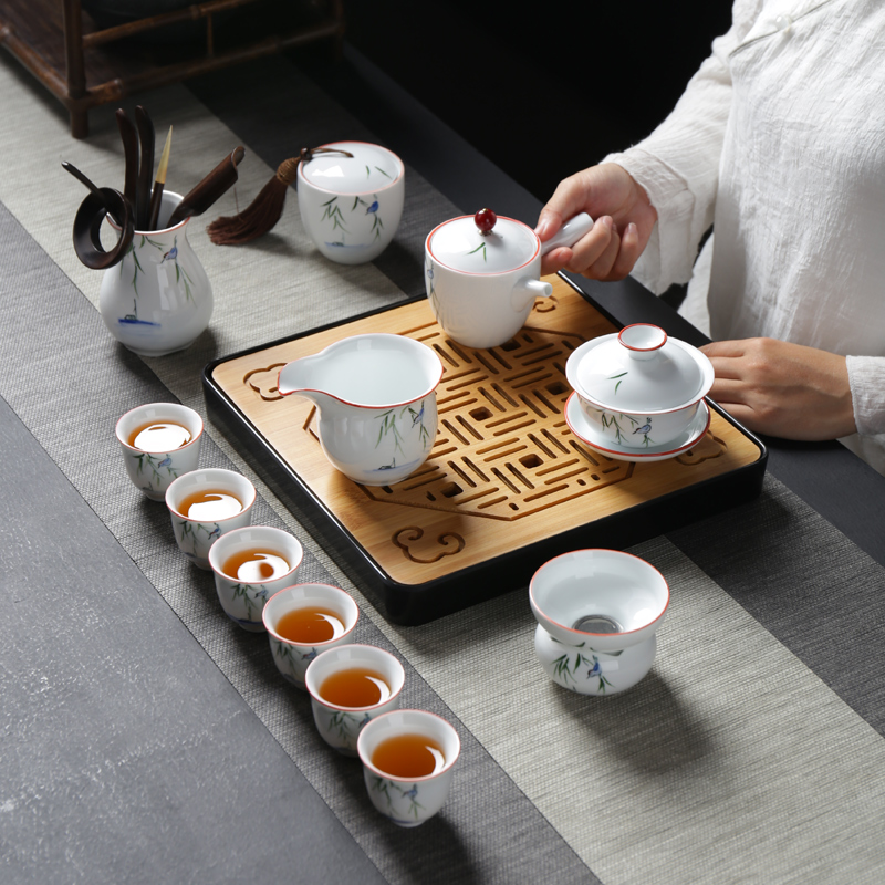 Ceramic hand - made tea sets travel four cups is suing household contracted white porcelain tea pot a pot of kung fu tea tray