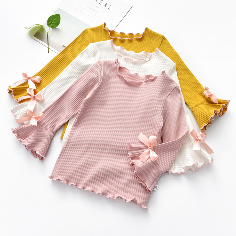 Áo thun bé gái 2018 mùa thu mới phiên bản Hàn Quốc của tai gỗ màu tinh khiết áo cotton trẻ em tay dài áo thun bé quan ao tre em