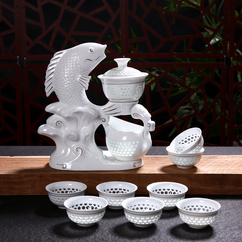 Lazy tea set suits for domestic ceramics semi automatic and exquisite hollow out kung fu tea tea cups of tea to prevent hot
