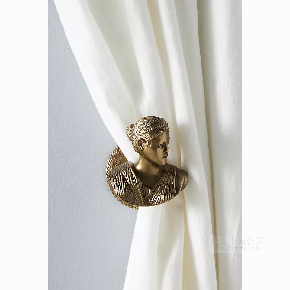 A pair of Classical Copper Curtain hooks at the Athena Classical Bronze Curtain by the Imported Window in Downtown New York