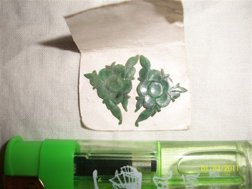 A pair of all green jade flowers