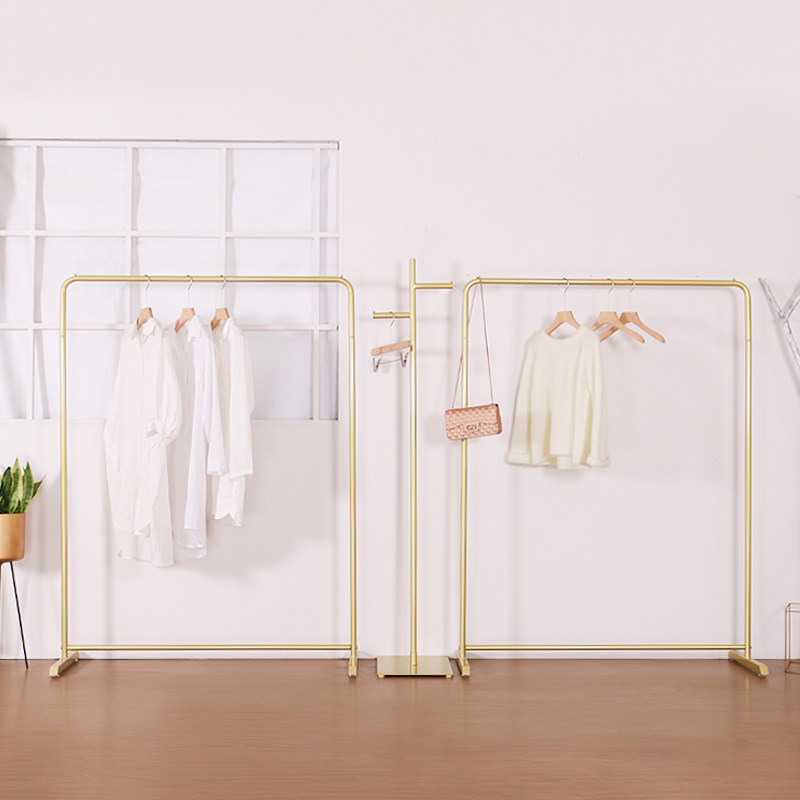 Clothing store display rack Gold clothing rack Women's store shelves Floor-to-ceiling hangers Clothes racks Wrought iron simple