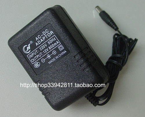 The DC 12V 800mA power adapter is wrapped