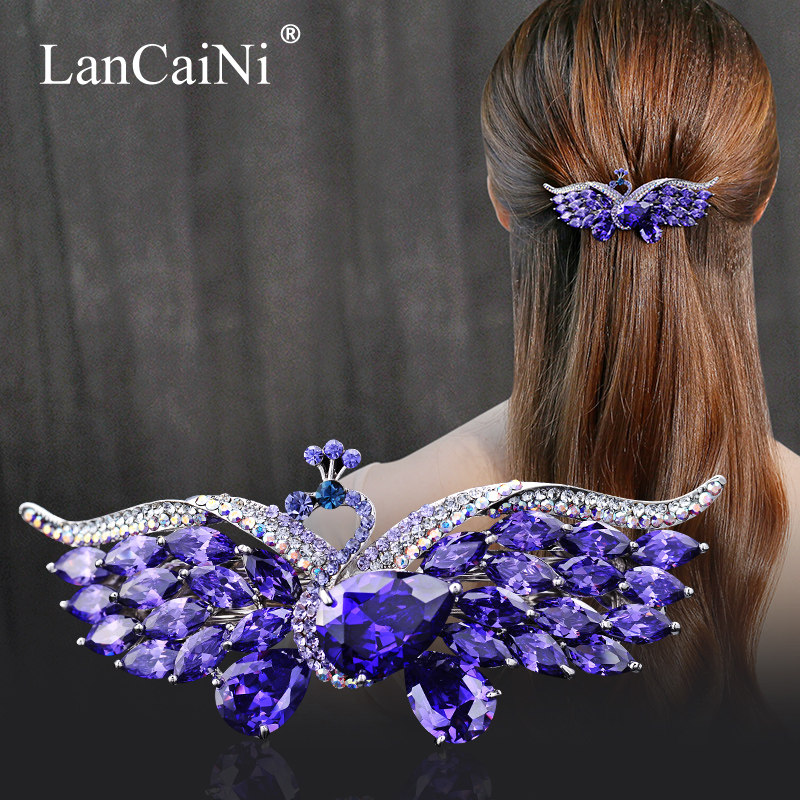The back of the clip has a spring clip on the back of the head with a Korean large semi-haired peacock high-end crystal mom clip headpiece clip