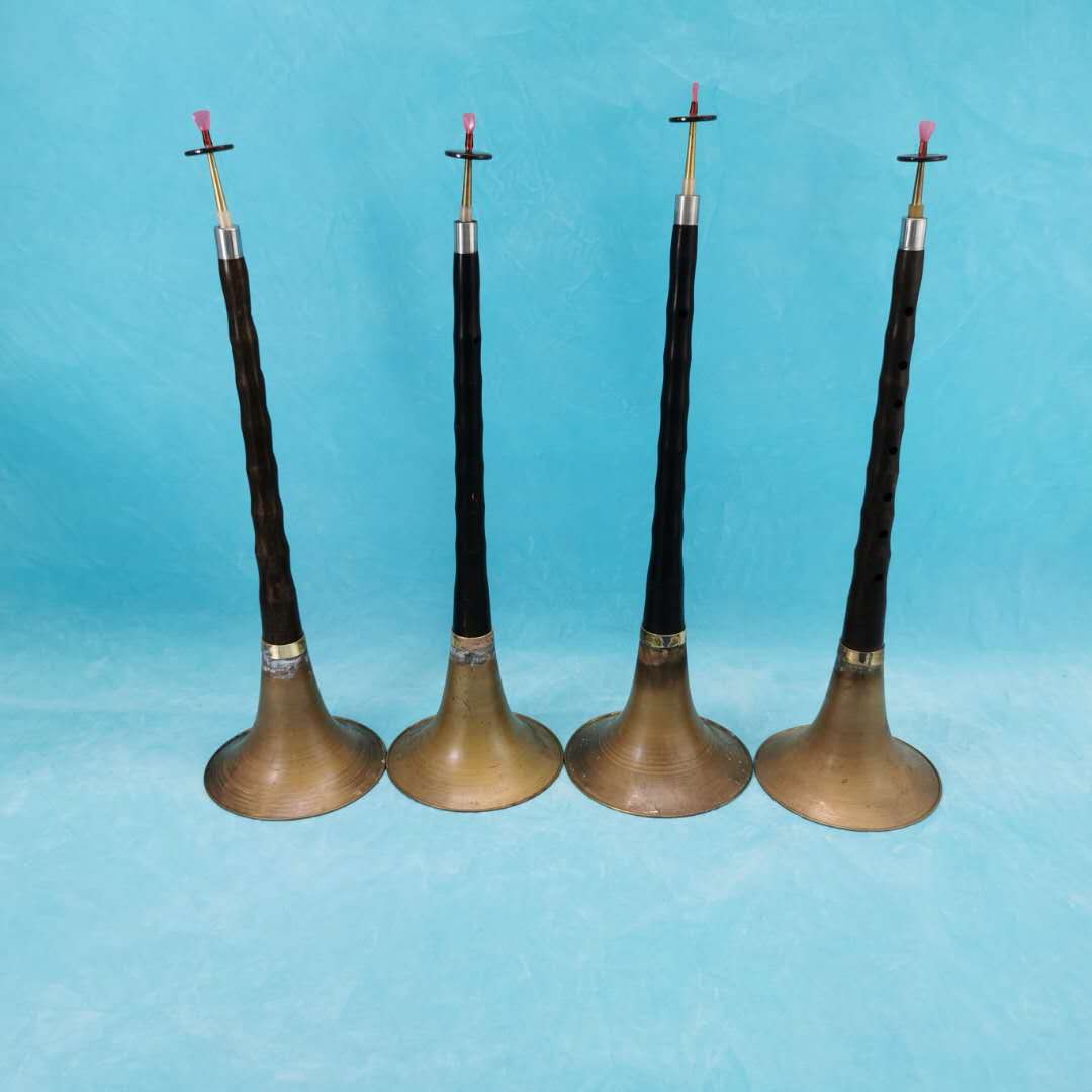 Folk old objects red nostalgic collection old musical instruments red and white wedding horn old-fashioned old suona film and television props
