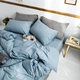 Kiểu Nhật denim in bông màu xám bông rửa ròng bông màu đỏ rắn đơn giản giường lanh khí quyển Bắc Âu - Bộ đồ giường bốn mảnh chăn ra gối nệm