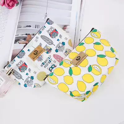 Korean cosmetics bag storage bag small large capacity portable hand-held waterproof travel portable cartoon lady simple