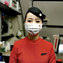 Stickers adorn the white white red air attendant with small red heart